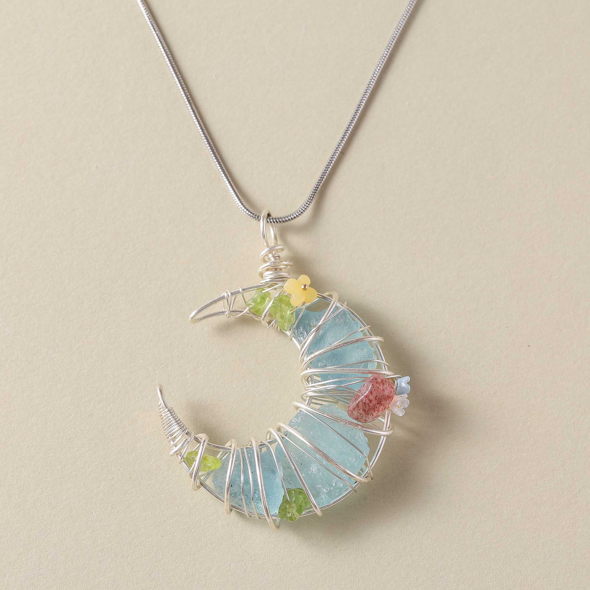 Moonlight Dreamweaver – Blue Crystal Crescent Pendant