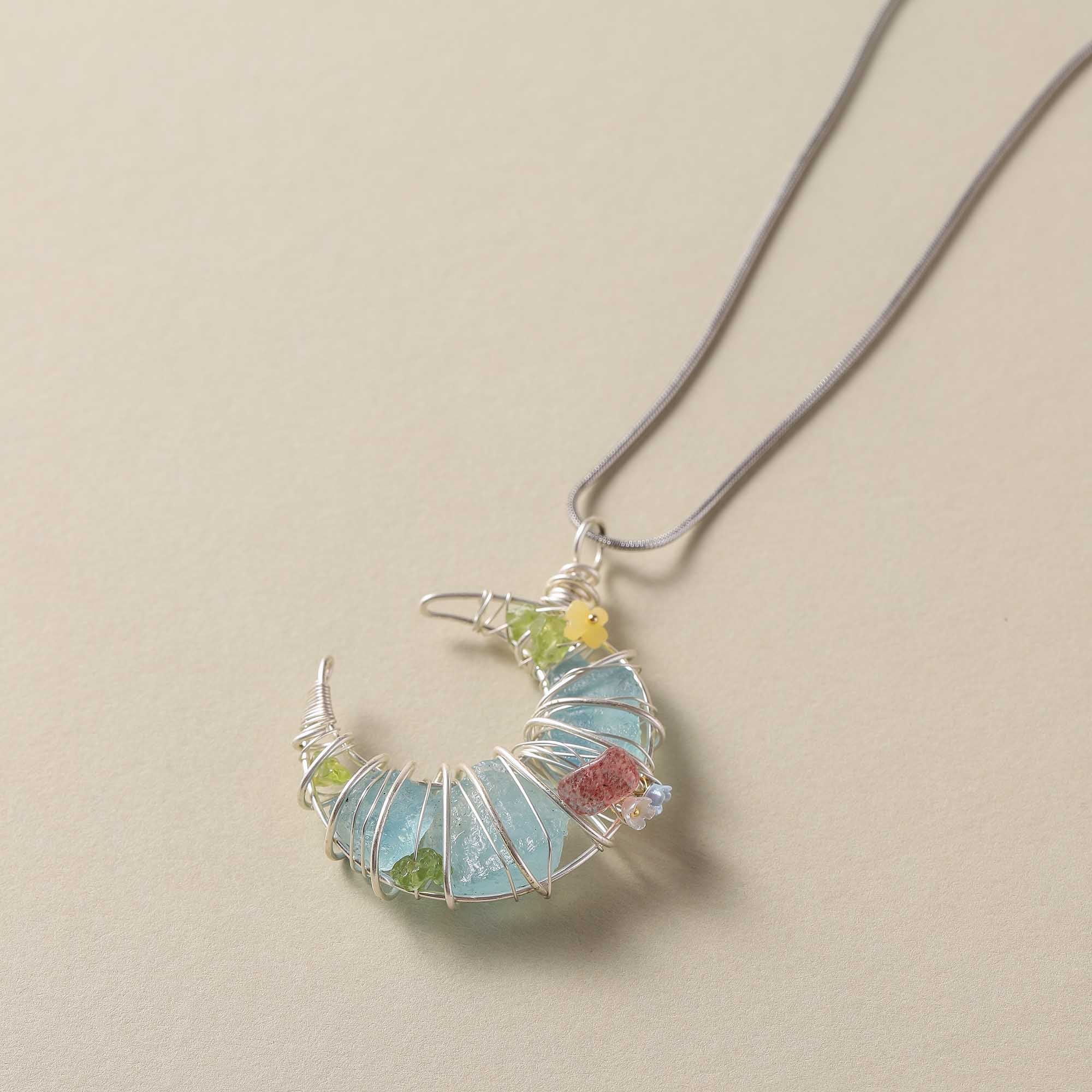 Moonlight Dreamweaver – Blue Crystal Crescent Pendant